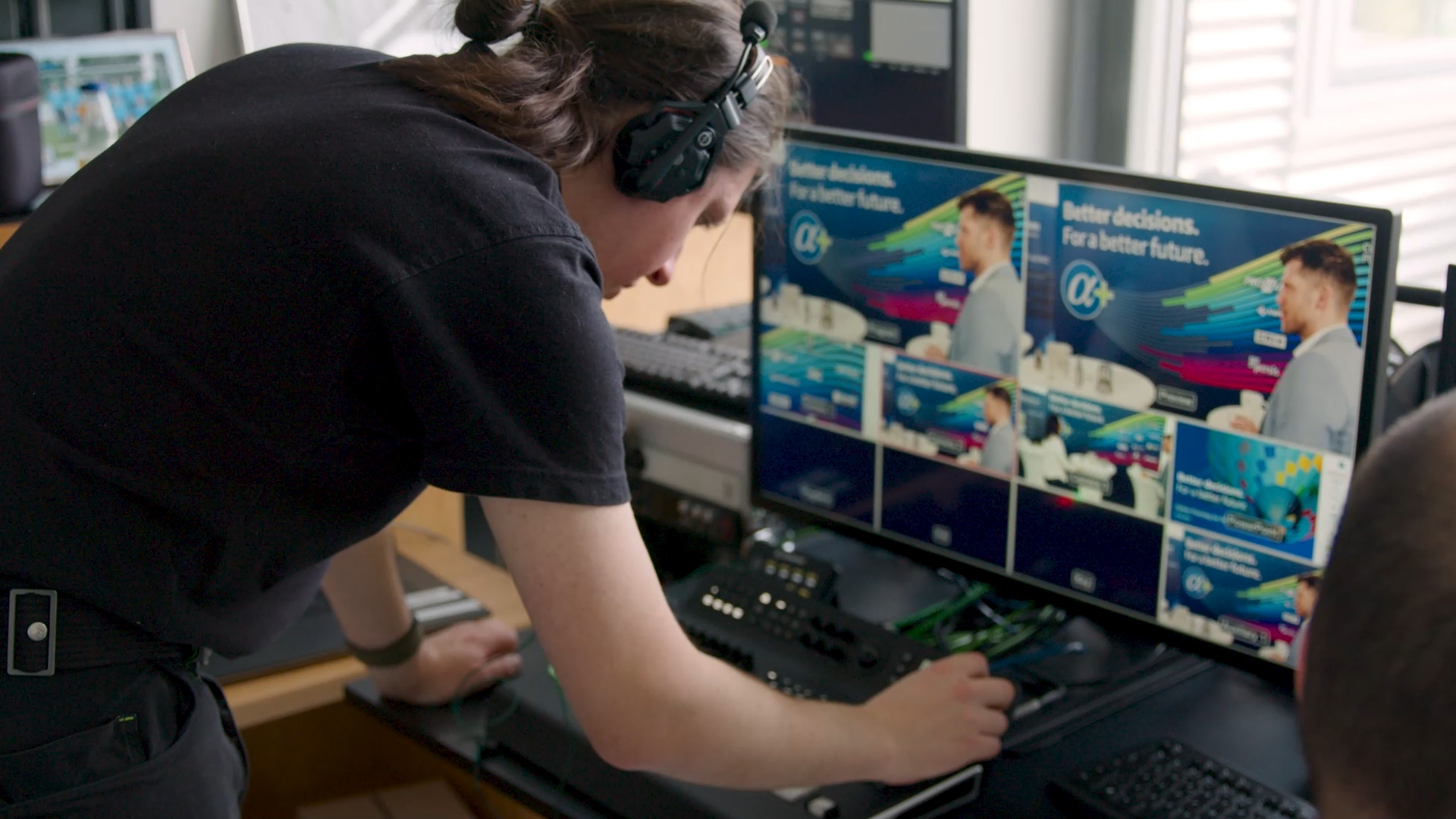 Worker adjusting equipment during a livestreaming production