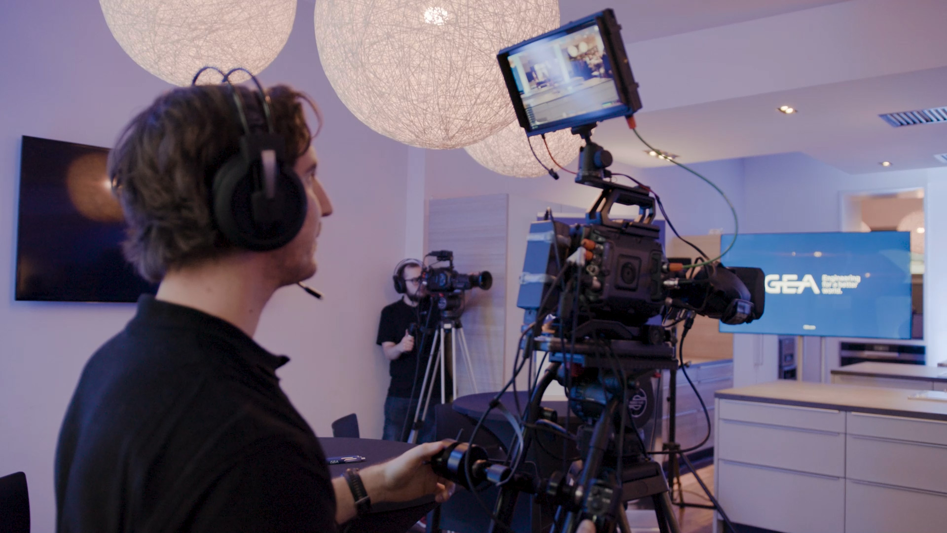 Two cameramen at work on a production set